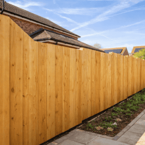 A close-up of a bespoke timber fence installed in a Welshpool garden, showcasing craftsmanship.