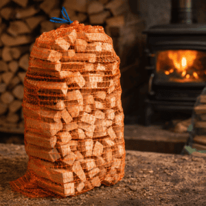 Firewood bundle in a workshop with a wood-burning stove in the background.